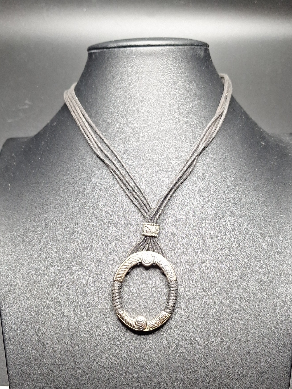 Silver-Tone Circular Pendant Necklace with Black Cord